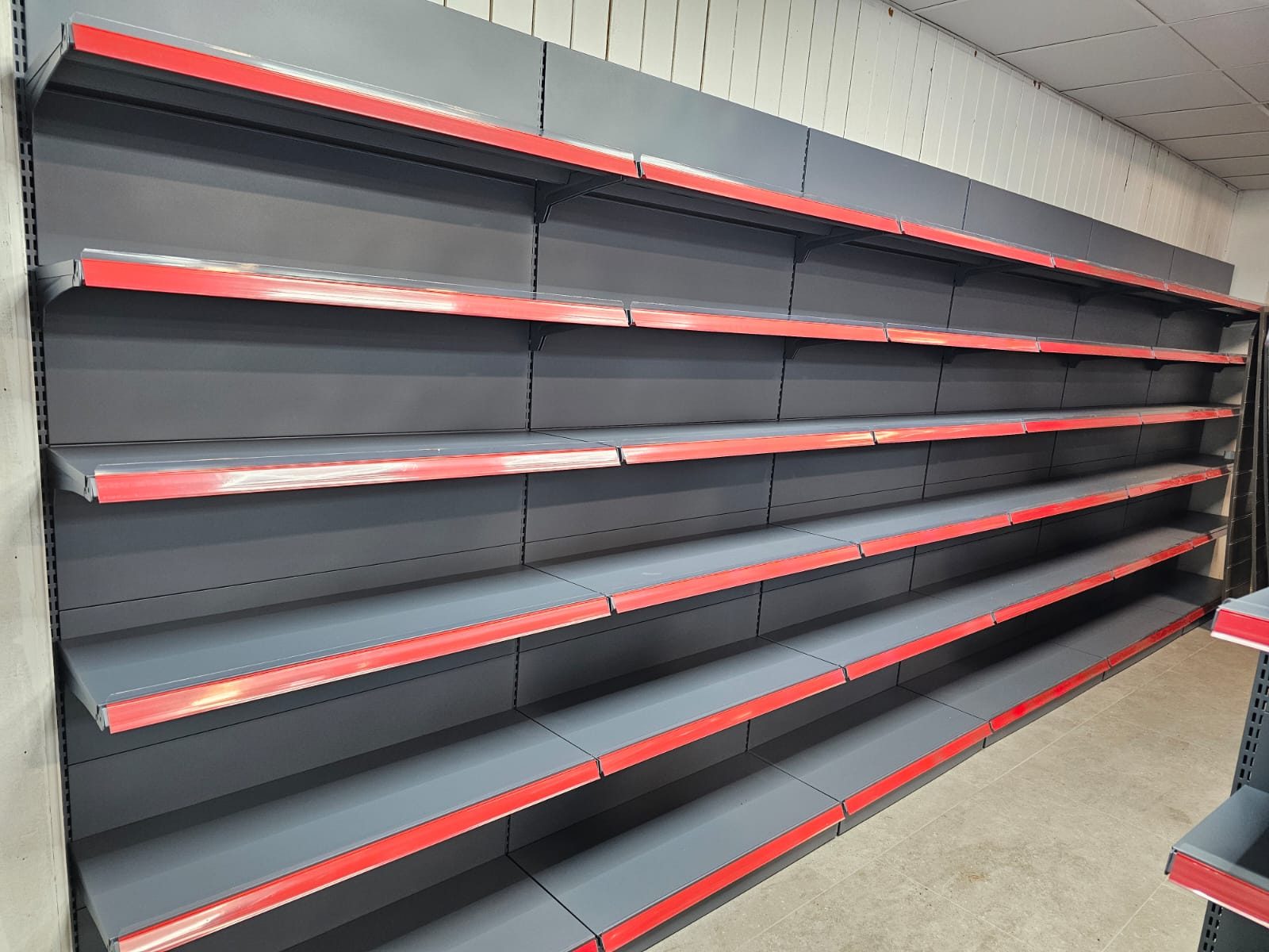 Wall shelving run with price rails