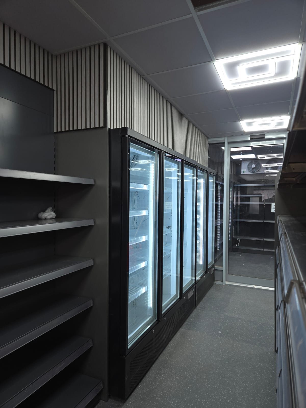 Glass-door display fridges in a convenience store